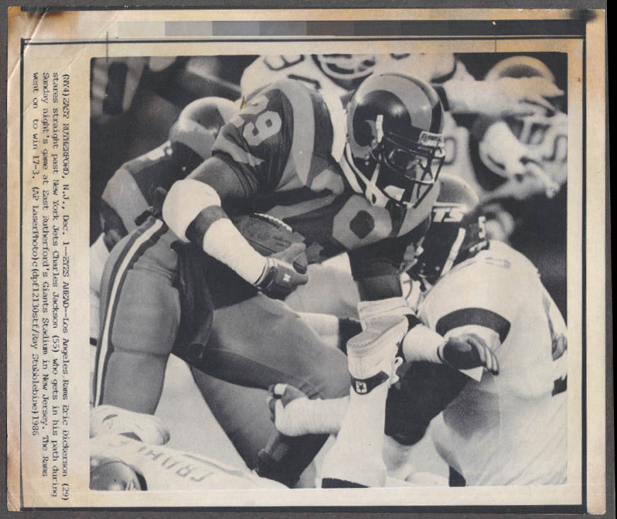 Los Angeles Rams Eric Dickerson runs past Jets Charles Jackson photo 1986