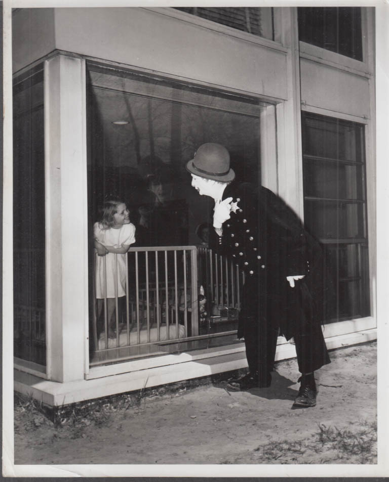 Clown policeman amuses little girl circus photo ca 1950s