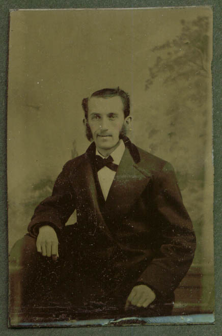 Flat-head man sideburns seated studio tintype