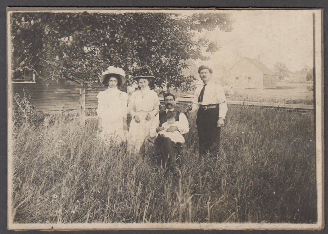 Grandfather grandmother father mother baby outdoor photo on farm ca 1900