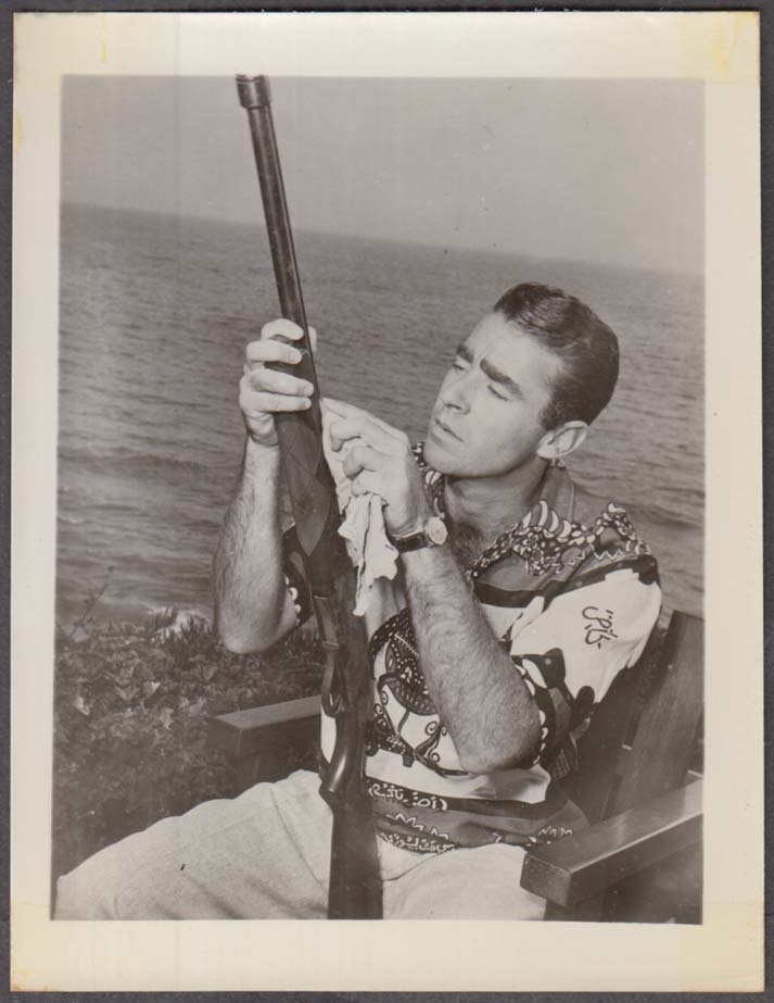 Actor Peter Lawford cleaning his pump shotgun fan club snapshot 1950s