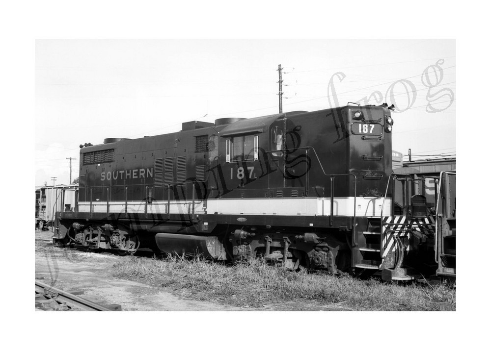 Southern Railway diesel locomotive #195 in front of power lines 5x7